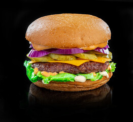 Fresh tasty burger on black background