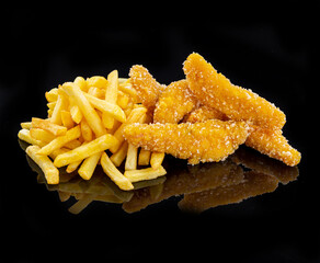 Chicken tenders, breaded nuggets and French fries, on a black background
