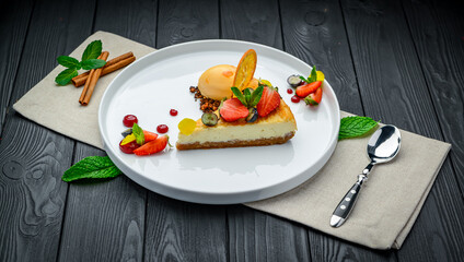 cheesecake with berries and sorbet on plates