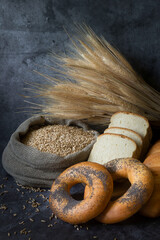 Top view of sliced wholegrain bread on dark ructic wooden background closeup. Various tasty breads...