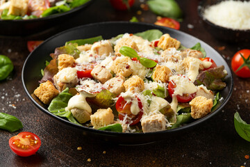 Vegetarian ceasar salad with meat free chicken pieces cherry tomatoes croutons and lettuce
