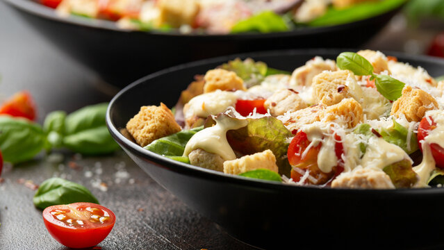Vegetarian ceasar salad with meat free chicken pieces cherry tomatoes croutons and lettuce