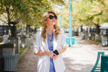 Fototapeta premium Business lady with a phone in her hands