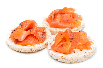 Tasty Rice Cake Sandwiches with Fresh Salmon Slices Isolated on White. Easy Breakfast and Diet Food. Crispbread with Red Fish. Healthy Dietary Snacks - Isolation