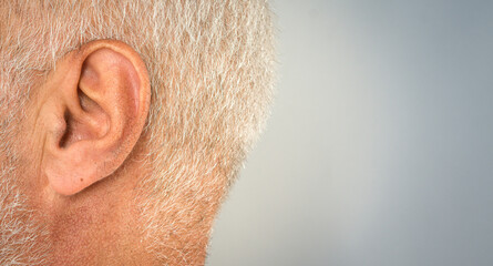 close up of old mans ear