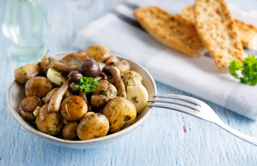 Mushrooms in garlic butter sauce. Mushrooms prepared with garlic , fresh butter and parsley served as a appetizer.