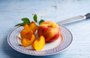 Platerina fruit a stone fruit. platerina a stone fruit has the characteristics of a nectarine and a paraguayan on a white background.