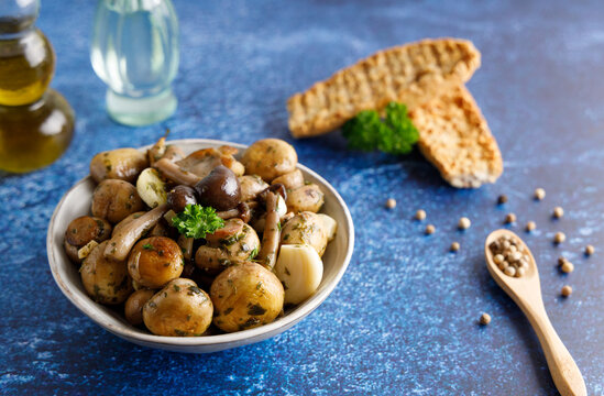 Mushrooms in garlic butter sauce. Mushrooms prepared with garlic , fresh butter and parsley served as a appetizer.