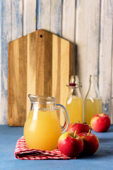 Healthy Organic Apple Juice in a Jug and Bottle Napkin Red Apples Vertical Harvest Autumn