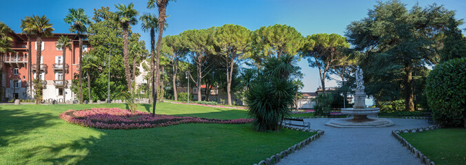 park landscape Opatija, croatian coast, with palm trees and flower bed