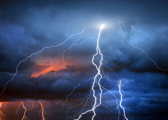 Fork lightning striking down during summer storm