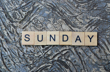 sunday text in wooden square, business quotes