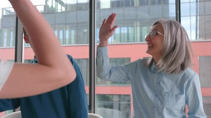 Happy and excited creative group of people raising hands up giving high five. - Powered by Adobe