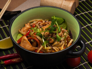 udon with chicken and vegetables. traditional japanese dish