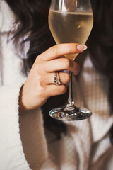 Engagement ring on bride's finger during wedding preparations