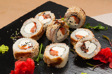 sushi rolls with eel, salmon and cream cheese