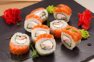 sushi rolls with salmon, shrimp, cucumber and cream cheese