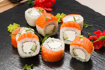 sushi rolls with salmon, cucumber and cream cheese. close-up