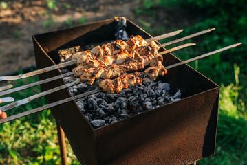 Marinated skewers are prepared on a barbecue grill over charcoal. BBQ grilled beef kebab.