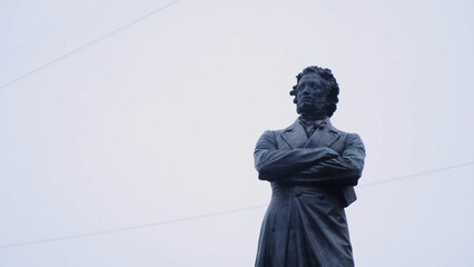 Statue of Alexander Pushkin, famous Russian poet. Concept. The statue of Pushkin in St. Petersburg - obrazy, fototapety, plakaty