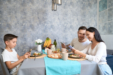 Mom, dad and son have breakfast in a familiar environment