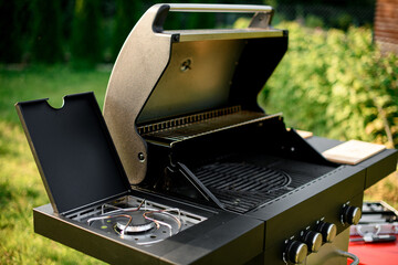selective focus on grate of modern portable BBQ barbecue grill