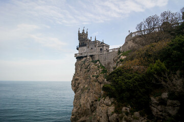 Fototapeta na wymiar Gothic castle on a cliff overlooking the sea