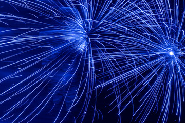 Naklejka premium abstract blue holiday fireworks background
