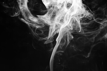 abstract fragment movement of white smoke on black background.