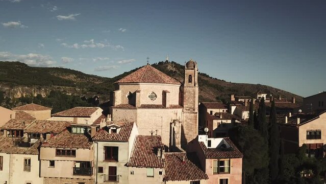 drone shot of an old town with a historical church in spain.