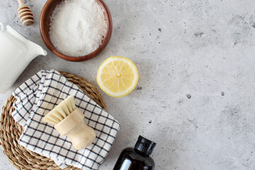 Zero waste concept, sustainable lifestyle flat lay. natural eco bamboo toothbrush, coconut soap, handmade detergent, crystal deodorant, luffa, bamboo ear sticks, green leaves