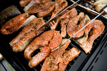 Close-up view of tasty salmon steaks on grill