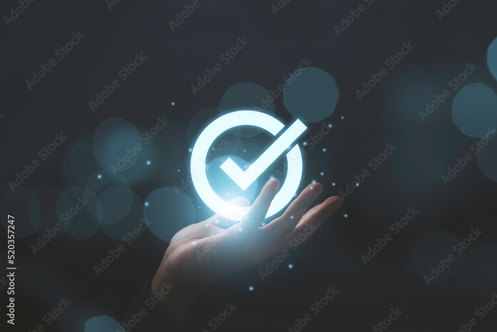 Aufkleber Hand holding virtual glow correct sign and tick correct mark to approve document and project concept.