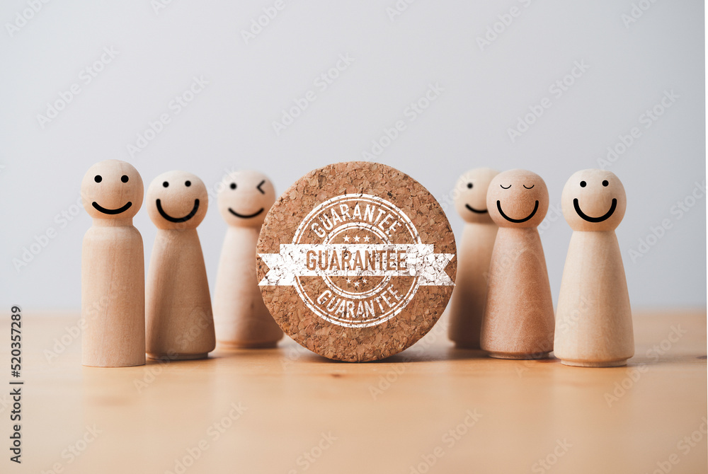 Aufkleber wooden miniature figure standing together with guarantee label which print screen on wooden block fo