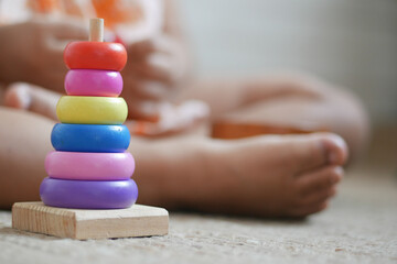 child playing with a Baby toys on bed, Child development concept.