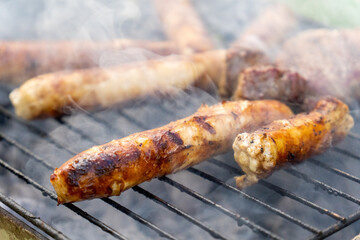 Close up of meat sausages on grill