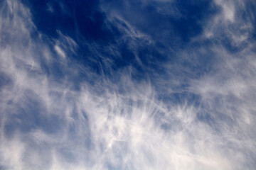 Abstract sky with clouds with rich colors and feathery clouds