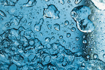 Water drops on glass at daylight