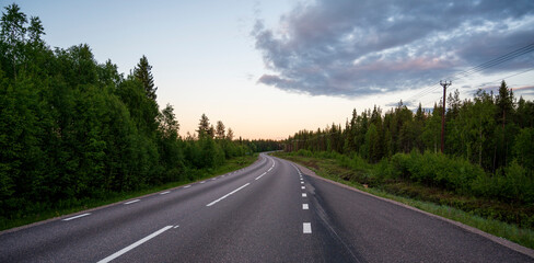 Winding asphalt road in forest