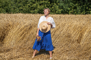 Portrait of a beautiful woman in a wheat field