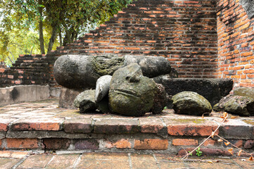 Fototapeta na wymiar Ancient buddha statue at the ruins of ancient city of Ayutthaya (Ayutthaya Historical Park), Phra Nakhon Si Ayutthaya Province, Thailand. (Public domain)