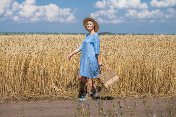 Village woman walking along a country road