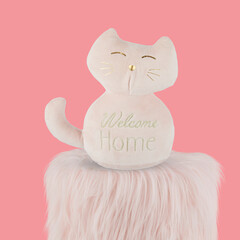 cat doll isolated on pink background with clipping path