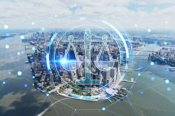 Aerial panoramic helicopter city view on Lower Manhattan district and financial Downtown, New York, USA. Glowing hologram legal icons. The concept of law, order, regulations and digital justice