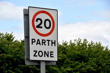 Bilingual road sign showing a 20 mph speed limit at the approach to a village in Wales - obrazy, fototapety, plakaty