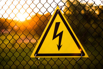 warning sign danger on the fence of the power plant close-up