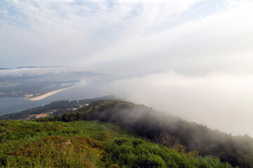 Mouth of the Miño river with fog. View from Mount Tegra, on the other side of Portugal. A Guarda, Galicia, Spain.