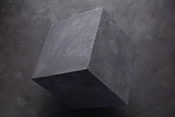 Concrete cube shape on floor background texture. Cement block as construction concept