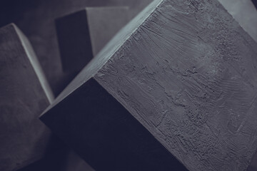 Cement blocks near wall background construction concept. Concrete cube shape abstract art idea