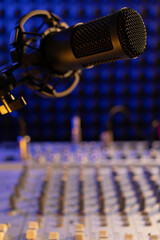 Microphone and sound mixer on desk table. Music audio concept in sound record studio